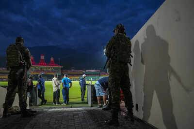 Dharamsala-Security-personnel-stand-guard-amid-a-practice-session-ahead-of-an-I-.jpg