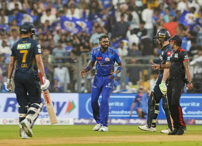 Mumbai-Mumbai-Indians-Hardik-Pandya-with-GT-batters-S-Gill-and-J-Buttler-durin-.jpg