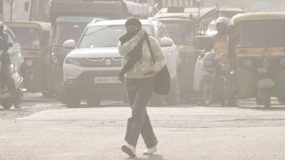 a-woman-covers-her-face-with-a-scarf-amid-rising-pollution-levels.jpg