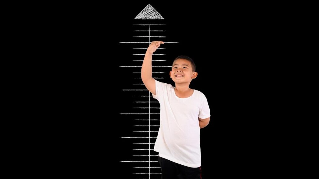 boy-measured-height-with-blackboard.jpg