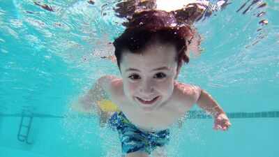 child-swimming-underwater.jpg